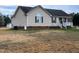 Side view of a charming home, showcasing a covered porch and manicured landscaping at 1925 Eagle View Drive Dr, Wendell, NC 27591