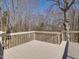 The spacious back deck is ideal for outdoor entertaining and relaxation with wooded views at 1961 Indianwood Ct, Raleigh, NC 27604
