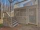 An elevated deck and stairs with wood lattice provides great backyard access at 1961 Indianwood Ct, Raleigh, NC 27604