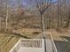 View of a wooded backyard from the back deck area at 1961 Indianwood Ct, Raleigh, NC 27604