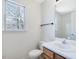 Bathroom with a window, toilet, and vanity at 1961 Indianwood Ct, Raleigh, NC 27604