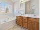 Bathroom featuring a bathtub and double vanity at 1961 Indianwood Ct, Raleigh, NC 27604