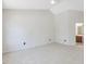 Large bedroom featuring neutral carpet, vaulted ceilings, and an en-suite bathroom at 1961 Indianwood Ct, Raleigh, NC 27604