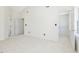 Bright bedroom featuring neutral carpet, vaulted ceilings, and multiple access doors at 1961 Indianwood Ct, Raleigh, NC 27604
