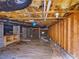 A view of the crawlspace shows cinder block supports and insulation at 1961 Indianwood Ct, Raleigh, NC 27604
