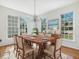 Elegant dining room showcasing a large wooden table, chairs, and natural lighting at 1961 Indianwood Ct, Raleigh, NC 27604
