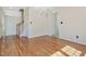 Spacious dining room with hardwood floors, large windows and neutral walls at 1961 Indianwood Ct, Raleigh, NC 27604