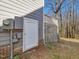 A small access door for exterior storage in the home's gray siding at 1961 Indianwood Ct, Raleigh, NC 27604