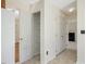A hallway with tile floors, a pantry, and a closet at 1961 Indianwood Ct, Raleigh, NC 27604