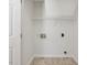 Bright laundry room with tile floor and hookups at 1961 Indianwood Ct, Raleigh, NC 27604