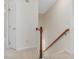 Upstairs hallway featuring a wooden railing and white doors leading to various rooms at 1961 Indianwood Ct, Raleigh, NC 27604