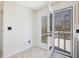 Bright sunroom features tile flooring and access to the back deck through double doors at 1961 Indianwood Ct, Raleigh, NC 27604