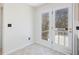 Bright sunroom features tile flooring and access to the back deck through double doors at 1961 Indianwood Ct, Raleigh, NC 27604