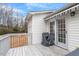 Back deck featuring an awning and railings, providing a comfortable outdoor space at 201 Moss Creek Dr, Clayton, NC 27520