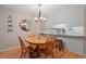Charming dining area with wooden table and chairs complemented by shiplap accent wall at 201 Moss Creek Dr, Clayton, NC 27520