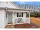 Inviting front porch with a bench, providing a welcoming entrance to the home at 201 Moss Creek Dr, Clayton, NC 27520