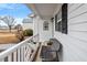 Cozy front porch featuring a bench and decorative details, perfect for relaxing outdoors at 201 Moss Creek Dr, Clayton, NC 27520