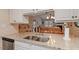 Open kitchen with view of the living area featuring granite counters and stainless steel sink at 201 Moss Creek Dr, Clayton, NC 27520