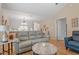 Inviting living room featuring vaulted ceilings, neutral tones, and comfortable seating arrangement at 201 Moss Creek Dr, Clayton, NC 27520