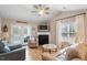 Cozy living room with fireplace, vaulted ceiling, and comfortable seating arrangement at 201 Moss Creek Dr, Clayton, NC 27520