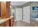 Bathroom featuring a granite vanity, and wooden cabinets at 204 Dartmoor Ln, Raleigh, NC 27614