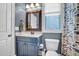 Bathroom featuring blue walls, a vanity and commode at 204 Dartmoor Ln, Raleigh, NC 27614