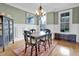 Traditional dining room showcasing wood floors, picture window and classic design at 204 Dartmoor Ln, Raleigh, NC 27614