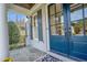Inviting front porch with stylish blue door and stone flooring at 204 Dartmoor Ln, Raleigh, NC 27614