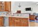 This Kitchen features granite countertops, custom wood cabinetry, and stainless steel appliances in an open-concept layout at 204 Dartmoor Ln, Raleigh, NC 27614