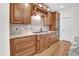 Gourmet kitchen features custom cabinetry, granite countertops, a gas cooktop, and stainless steel appliances at 204 Dartmoor Ln, Raleigh, NC 27614