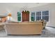 Comfortable living room showcasing natural light, cozy seating, and serene outdoor views at 204 Dartmoor Ln, Raleigh, NC 27614