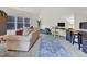 Spacious living room with comfortable seating, large windows, and natural light at 204 Dartmoor Ln, Raleigh, NC 27614