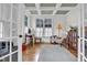 Well-lit office space with coffered ceilings, hardwood floors, and classic decor at 204 Dartmoor Ln, Raleigh, NC 27614