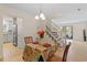 Open-concept dining area with kitchen and staircase at 205 Clancy Cir, Cary, NC 27511