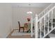 Cozy dining area with chandelier and staircase at 205 Clancy Cir, Cary, NC 27511