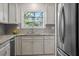 Charming kitchen features stainless appliances, granite countertops, and a bright window at 205 Clancy Cir, Cary, NC 27511