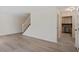 Open-concept living room with hardwood floors and staircase at 205 Clancy Cir, Cary, NC 27511