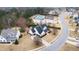 Aerial view of beautiful home in neighborhood featuring a well-manicured lawn and a circular driveway at 222 Friesan Way, Rolesville, NC 27571