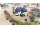 Aerial view of house with backyard, including patio set, trampoline, and privacy landscaping at 222 Friesan Way, Rolesville, NC 27571