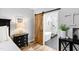 Modern bathroom with sliding barn door, a freestanding tub, and a glass-enclosed shower with white tile at 222 Friesan Way, Rolesville, NC 27571