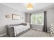 Cozy bedroom featuring a daybed, neutral carpet, and a bright window at 222 Friesan Way, Rolesville, NC 27571