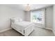 Bright bedroom with white furnishings, a chandelier, and a sunny window view at 222 Friesan Way, Rolesville, NC 27571