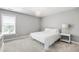 Bedroom with neutral walls, carpet, a chandelier, and a metal bedframe at 222 Friesan Way, Rolesville, NC 27571