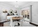 Eat-in breakfast nook featuring a round table, stylish chandelier and deck access at 222 Friesan Way, Rolesville, NC 27571