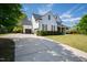 View of the home's exterior featuring an attached garage and extended driveway at 222 Friesan Way, Rolesville, NC 27571