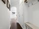 Hallway entrance with coat rack, bench, and dark hardwood floors leads to a living space at 222 Friesan Way, Rolesville, NC 27571