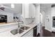 Bright kitchen featuring stainless steel appliances, granite countertops, and white cabinets at 222 Friesan Way, Rolesville, NC 27571
