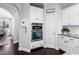 Gourmet kitchen with built-in stainless steel double ovens and access to walk-in pantry at 222 Friesan Way, Rolesville, NC 27571