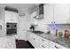 Modern kitchen features stainless steel appliances, granite countertops, and ample white cabinetry at 222 Friesan Way, Rolesville, NC 27571