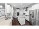Modern kitchen featuring white cabinets, granite countertops and stainless steel appliances at 222 Friesan Way, Rolesville, NC 27571